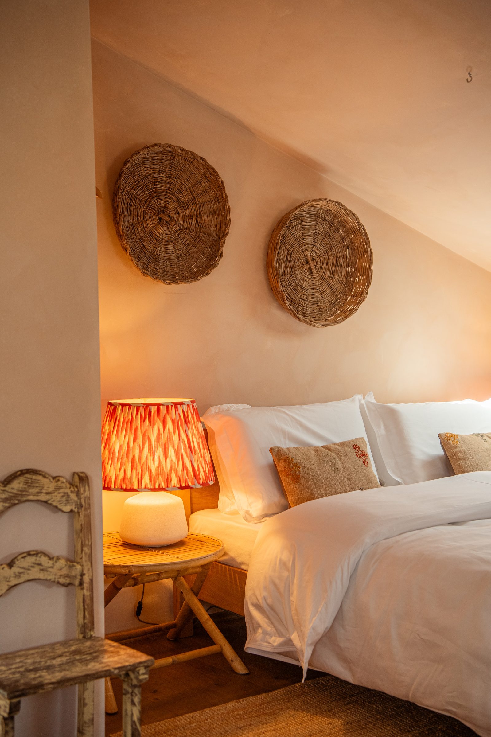 Bedroom with built-in oak wardrobes and woven baskets
