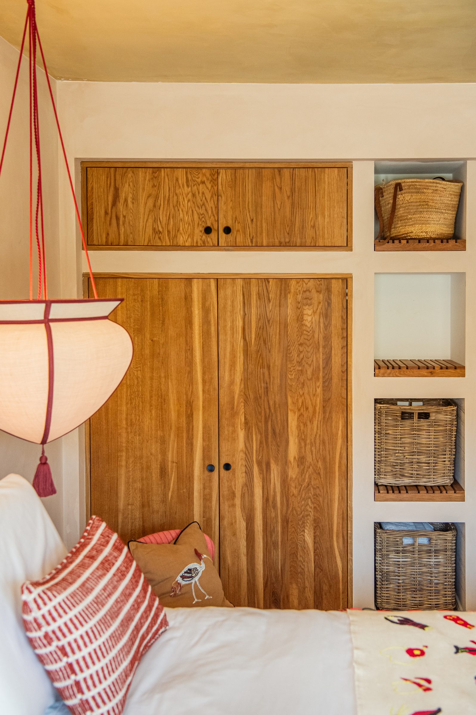 Primary bedroom with fuchsia headboard
